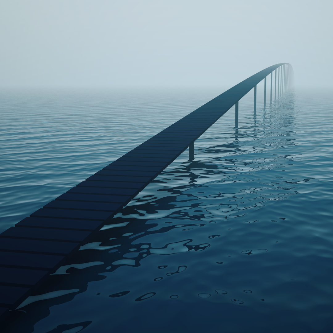 bridge over water continuing into horizon